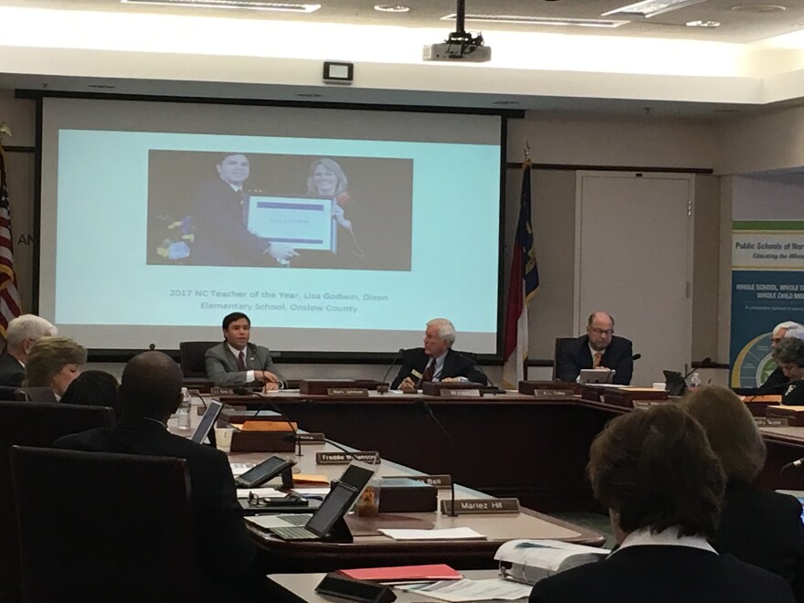 File photo of State Board of Education Chairman Bill Cobey (center-right) listening while State Superintendent Mark Johnson gives a monthly address to the board.