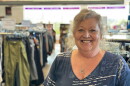 Carol Rose stands inside the WRC Thrift Store on U.S. 31 in Garfield Township. She's worked there for 40 years and is being honored by WRC for her many years of service. (Photo: Ed Ronco / IPR News)