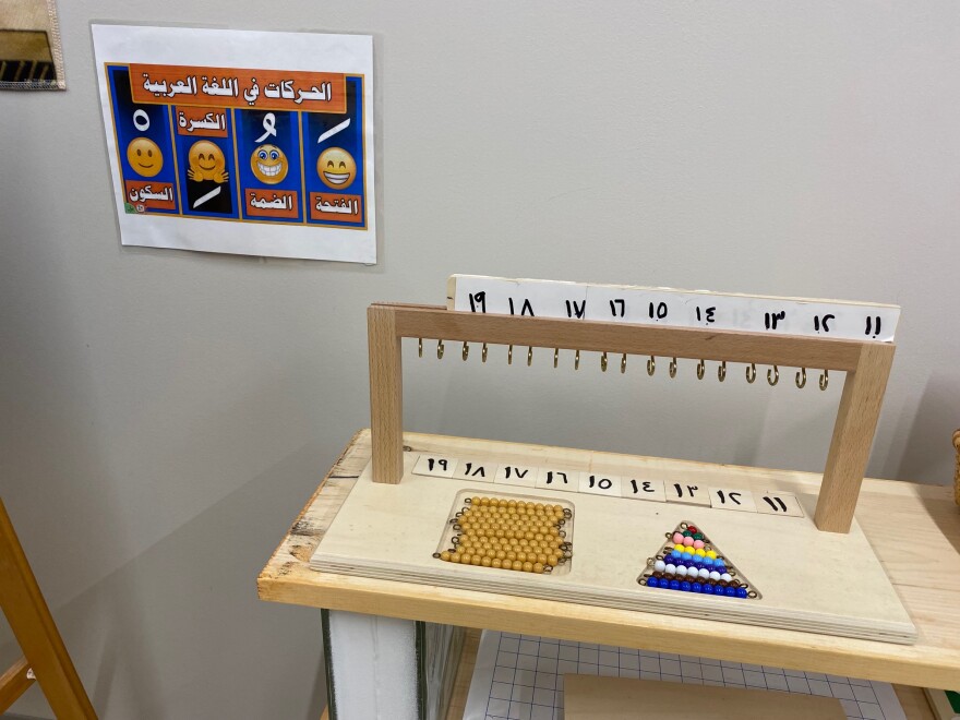 Hands-on math material and charts help ILIM School students learn Arabic numbers and letters.