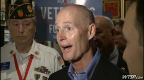 Scott talking to Reporters