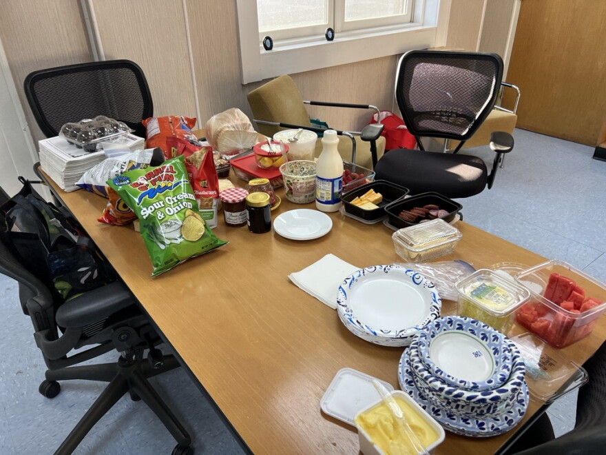 A large spread with contributions from all four Ironton election judges, including homemade bread, sits on a table Aug. 13, 2024, at Ironton City Hall. A total of 50 voters had cast ballots there as of 6:30 p.m.