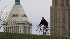 Riding a bike to get around more can help with a goal to be green, but the infrastructure also needs to be in place so you can be successful, says one professor.