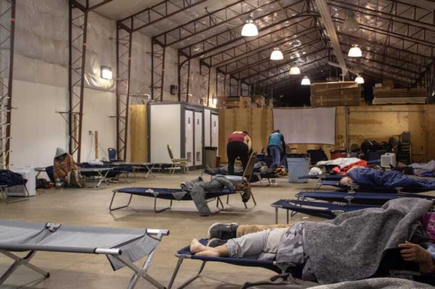 Patrons pack up their belongings at Juneau’s emergency warming shelter on its last morning open on Wednesday.