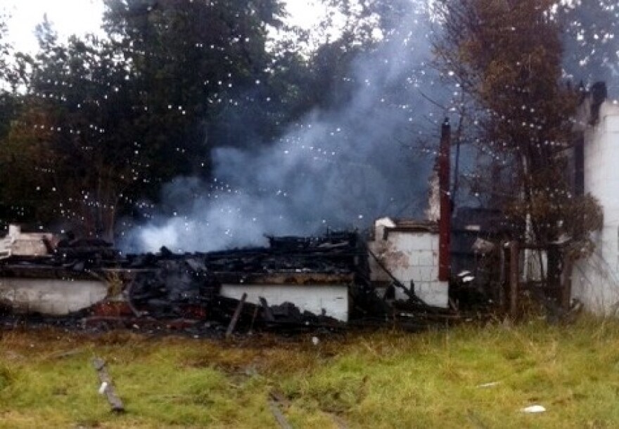 Smoke and debris is all that is left of the old Pentecostal church in Turley.