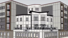 The draft shows the Southwest corner of the building will face the entrance of Switchyard Park with a butterfly-shaped roof.