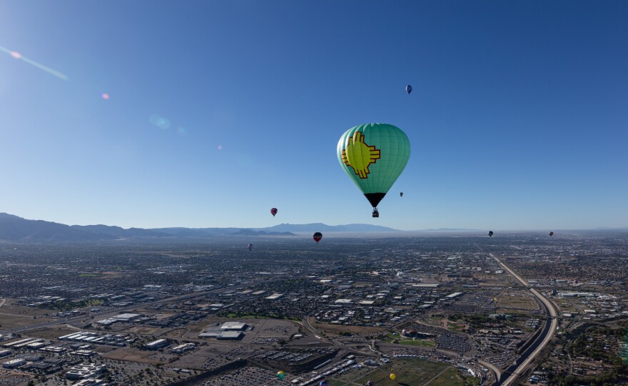 Balloonists dot the Albuquerque sky over 1500 feet above ground level.