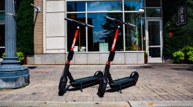 Two Spin e-scooters are shown on a sidewalk. The company is partnering with the City of Fort Collins and Colorado State University to rollout out hundreds of scooters later this month.