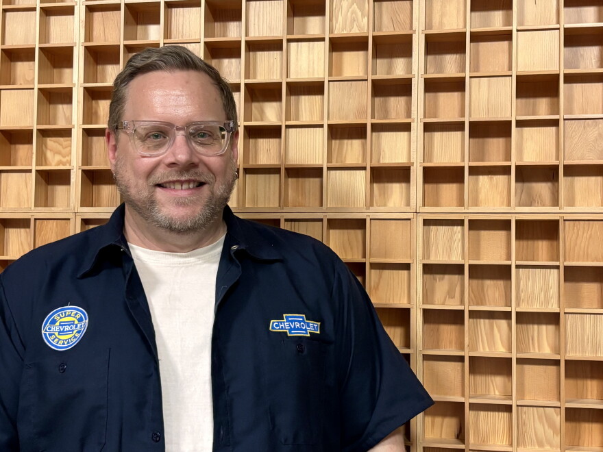 Matthew Morgan poses for a photo in the production studio.