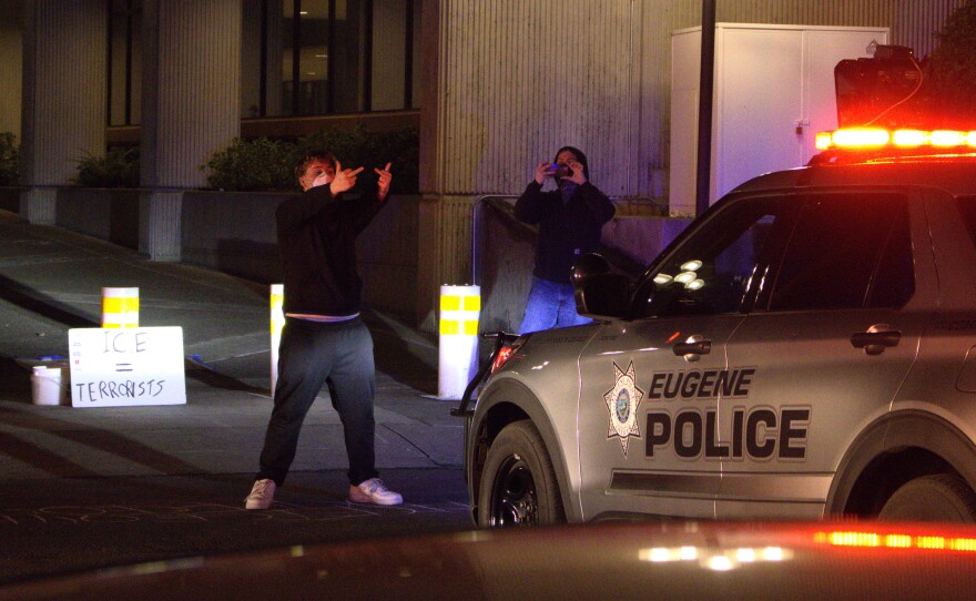 A protester confronts Eugene Police at the downtown federal building on Jan. 30, 2026.