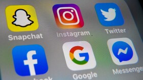 The logos of mobile apps Instagram, Snapchat, Twitter, Facebook, Google and Messenger are displayed on a tablet. (Denis Charlet/AFP via Getty Images)