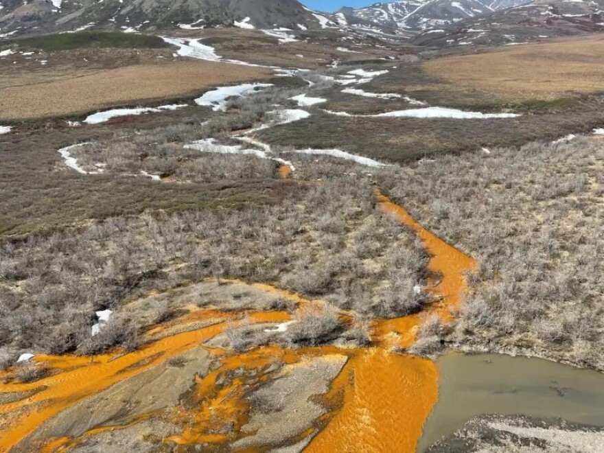 The orange tributary of the Kugororuk River in Alaska is an example of a "rusting river." These rivers are increasingly common in the Brooks Range of northern Alaska, the result of thawing permafrost. The orange color is caused by naturally occurring iron, but it can also indicate elevated levels of heavy metals.