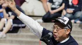 Butler University president Bobby Fong speaks during a pep rally for the Butler men's college basketball team in Indianapolis, Wednesday, March 31, 2010.