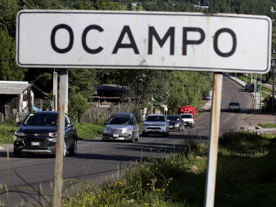 A hearse carrying the body of slain mayoral candidate Fernando Ángeles Juárez drives to a burial site last week in Ocampo, Mexico.