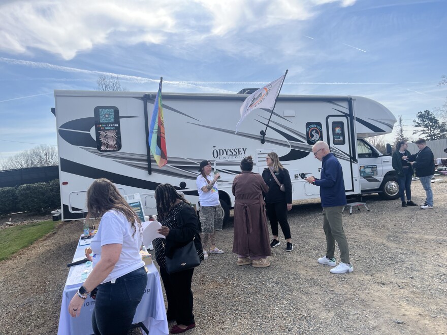 About a dozen people waited today to enter a 32-foot RV parked in Charlotte that aims to help LGBTQ+ and other underserved community members affirm their identities through official documentation.