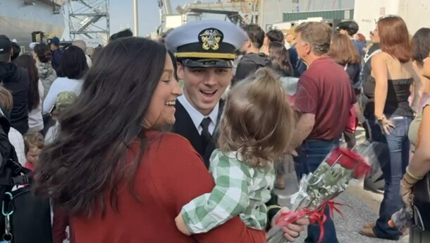 Families reunite at the homecoming for USS San Antonio.