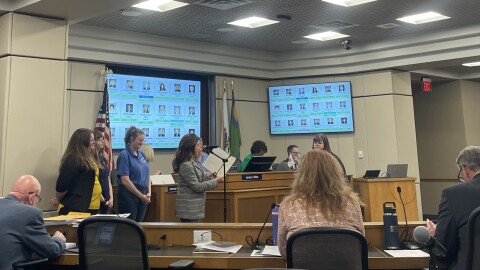Board member Jennifer Groves Allison, District 17, presents River Kitty Cafe with a proclamation on two years of business.