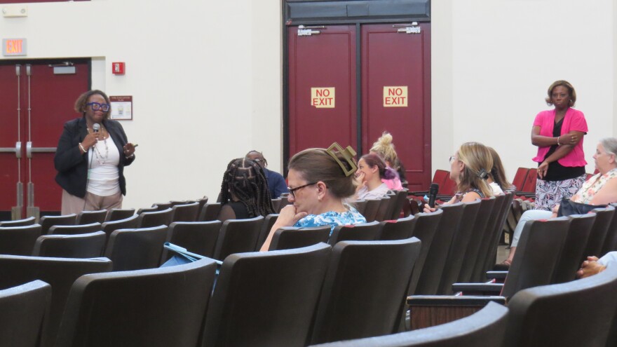 people sit in auditorium seats