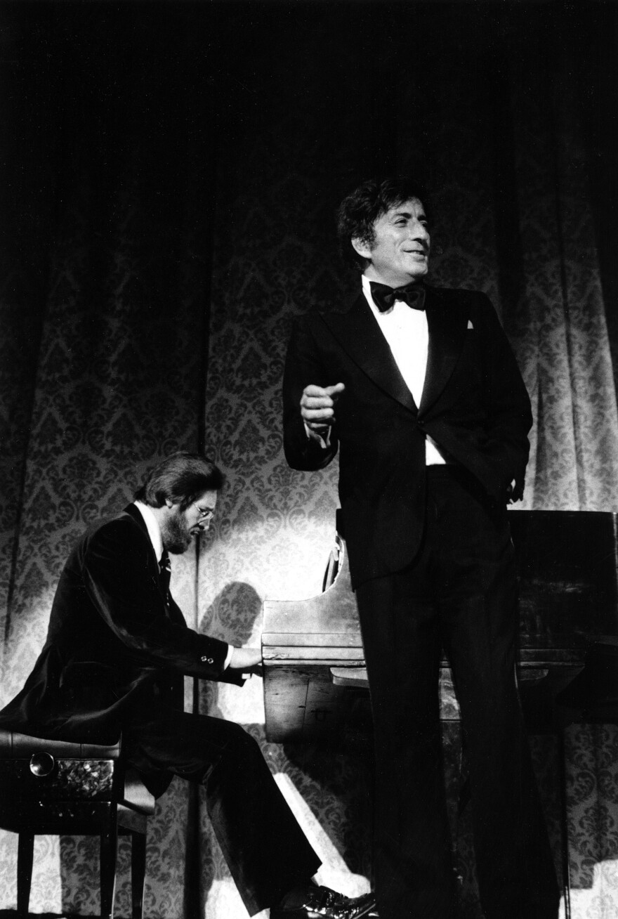 Singer Tony Bennett is accompanied by pianist Bill Evans as he performs before a Carnegie Hall audience in New York, at opening night of the Newport Jazz Festival, on June 25, 1976. 