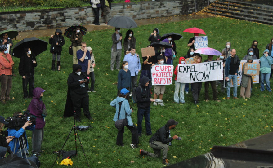 Protesters gathered in a courtyard outside the meeting of the Cornell Board of Trustees on Friday.