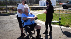  Judy and Tony Baalman, left, speak with Gov. Kate Brown at the Mountain View Estates Mobile Home Park in Talent. Most of the homes in this park were destroyed in the fire, including theirs.
