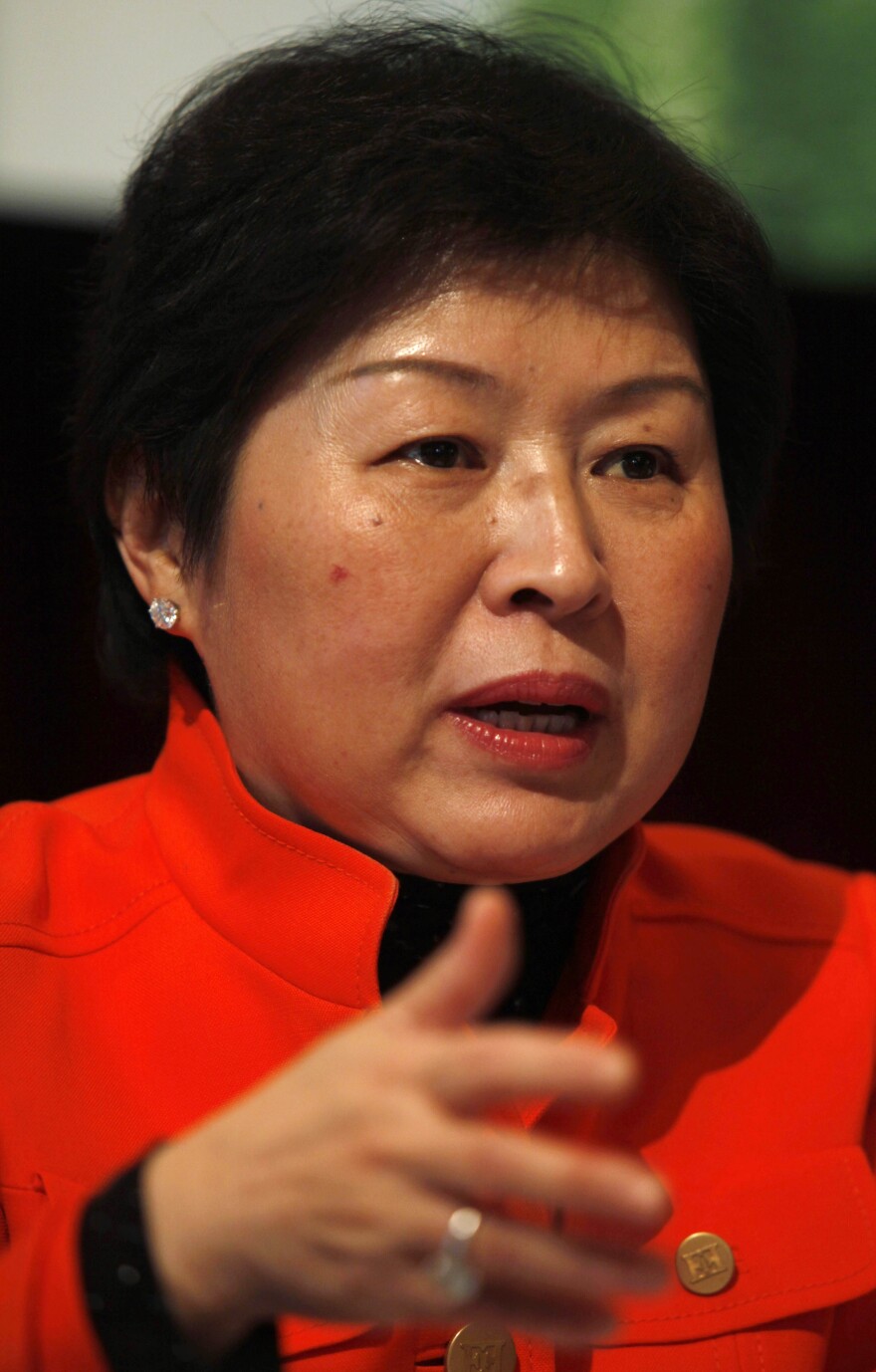 Zhang Yin, also known as Cheung Yan according to her Cantonese pronunciation, Chairlady of Nine Dragons Paper (Holdings) Limited, speaks at the company result announcement in Hong Kong Tuesday, March 17, 2009. (AP Photo/Kin Cheung)
