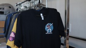 A rack of shirts with the Hot Tees logo hangs in the company's office on March 18, 2025