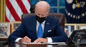 President Biden signs executive orders related to immigration in the Oval Office on Feb. 2, 2021. (Saul Loeb/AFP via Getty Images)