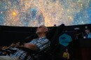 A guest observes the first images from Vera C. Rubin Observatory in Chile during the Rochester Music and Science Center’s “Rubin First Look Watch Party” on Mon, June 23, 2025, in Rochester, N.Y.