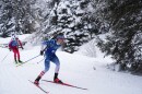 FILE - Campbell Wright, of the United States, right, competes in the men's 4x7.5-kilometer relay biathlon race at the 2026 Winter Olympics in Anterselva, Italy, Feb. 17, 2026.