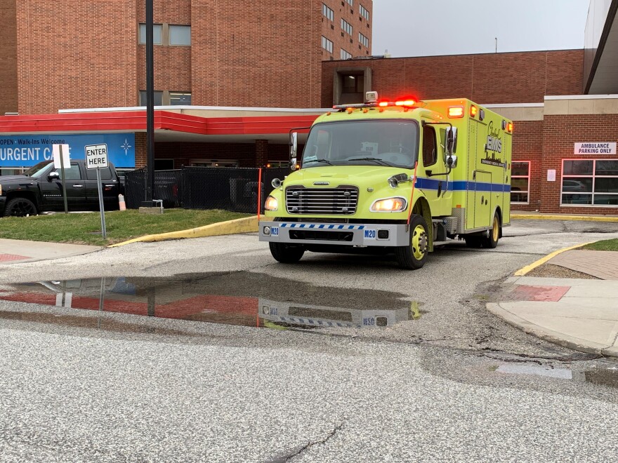 An ambulance leaves the former site of St. Vincent's emergency room. A spokesperson for Cleveland's EMS union said the closure means medics are transporting people from the now-shuttered ER to others in the city, stressing EMS resources.