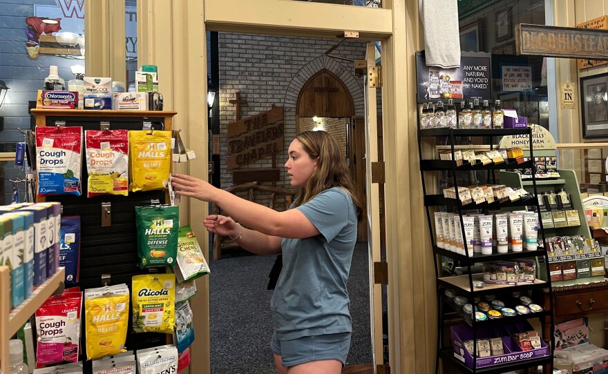 Tourist Alex Davis bought Dramamine at Wall Drug in Wall, South Dakota, to treat car sickness during her road trip from Kansas to Yellowstone National Park. (Arielle Zionts/KFF Health News)