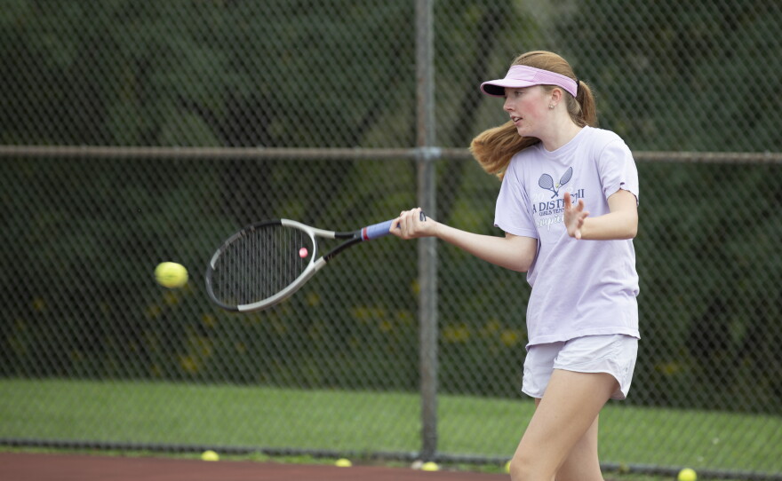 Cara Evans returns the ball during practice.
