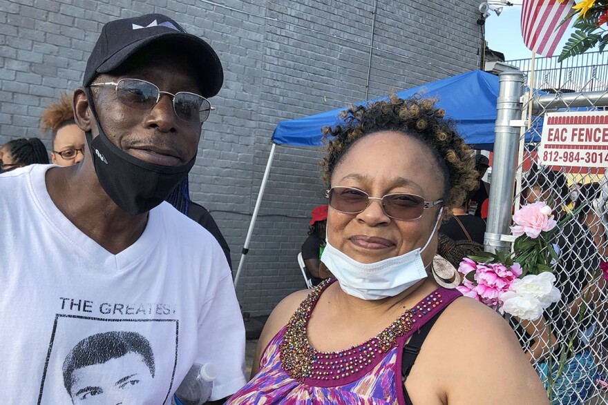 Victor Tellis and Lynnell Blakemore gathered with others in the Russell Neighborhood in West Louisville, to remember David McAtee of Yaya's BBQ.