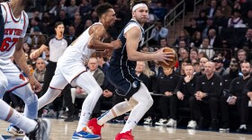 Dallas Mavericks guard Luka Doncic, right, is defended by New York Knicks guard Charlie Brown Jr., center left, during the first half of an NBA basketball game in New York, Thursday, Feb. 8, 2024. (AP Photo/Peter K. Afriyie)