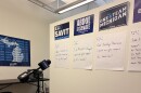 Microphone pointed at wall with democrat candidate signs and questions