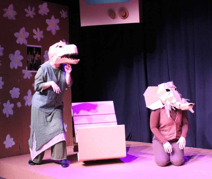The cardboard furniture and masks worn by the Antrobus' pet dinosaur and wooly mammoth remind the audience they are actually watching a play.