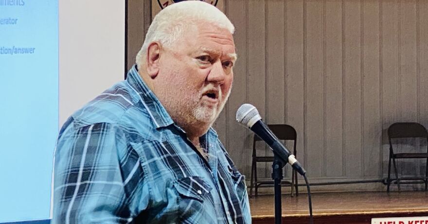 Farmer Phillip Garnett, who owns some of the land where a beef processing company wants to build a plant, spoke about his opposition to the plans during a meeting Monday, Sept. 27, in the old Pembroke school gymnasium.