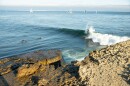 A surfer rides a wave at Steamer Lane, one of the spots that surfers say erosion is changing.