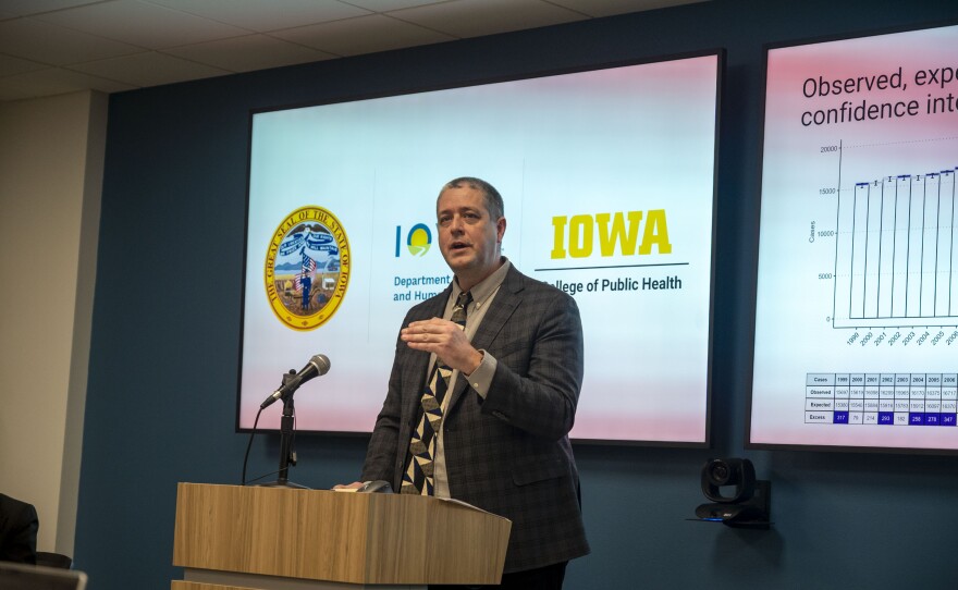 Jacob Oleson, a professor of biostatistics at the University of Iowa College of Public Health, presents preliminary findings from a state-funded research project looking into the cause of Iowa's high cancer rates.