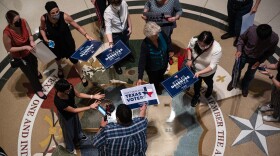 People opposed to the Texas Republican-led effort to pass new voting restrictions gather at the state capitol on July 10 in Austin.