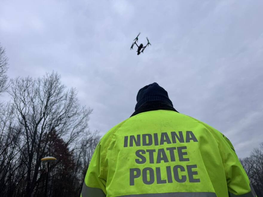 Indiana State Police deploy a drone as officers investigate a fatal crash on Stare Road 57 in Pike County