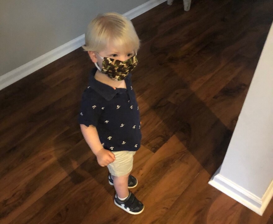 Graham Duhamel at age two wears his first protective face mask