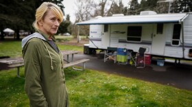 Delayne Anson stands outside her RV at Armitage Park in Eugene. Anson was temporarily staying at the campground after the City of Eugene posted a warning to move her trailer that was parked in West Eugene. She had 72 hours to move or have her RV towed.
