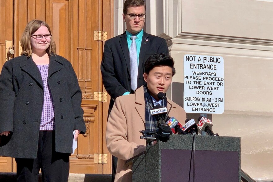 Megan Stoner, left, and Rep. Chris Chyung (D-Dyer), at lectern, support lowering the age limits to serve in the Indiana General Assembly.