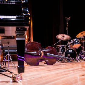 The instruments of a jazz band are set up on a stage. 