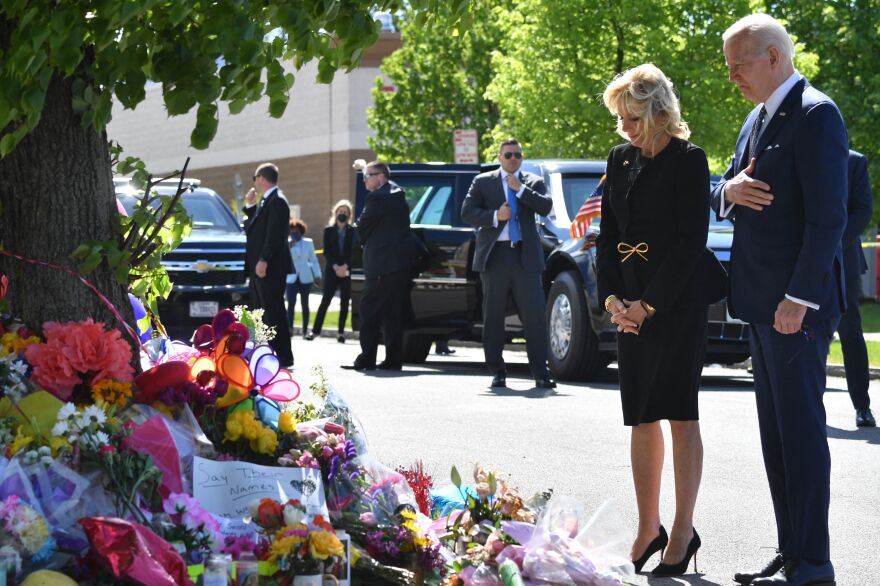 President Biden and first lady Jill Biden visit a memorial near the Tops grocery store on Tuesday in Buffalo, N.Y., where 10 people were killed in a mass shooting on Saturday.