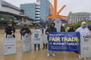 People gathered in downtown Milwaukee in support of worker-centered trade policy.