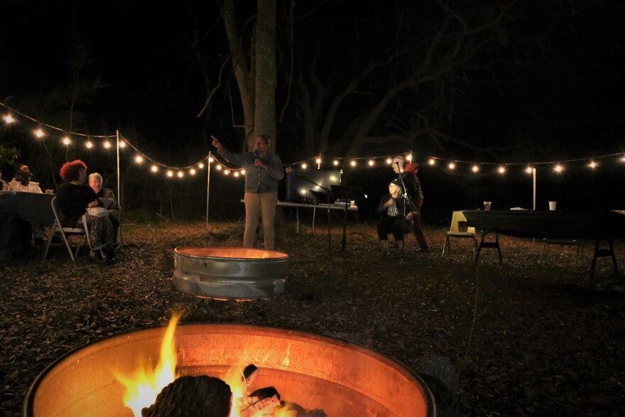 Belinda Jones welcomes visitors to her family's monthly Campfire Supper with Stories and Songs on their St. Helena Island farm. The event celebrates Gullah culture and the contributions of African Americans.