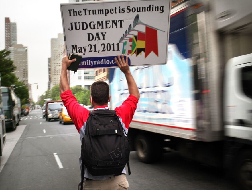 May 13:  A believer walks through the streets of Manhattan.