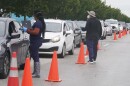  Drivers line up for COVID-19 tests on Tuesday, Dec. 21, 2021, in North Miami.
